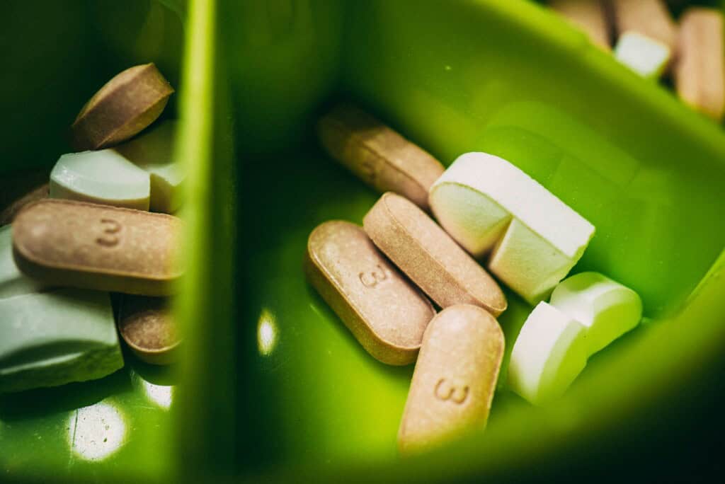 tablets in a green container