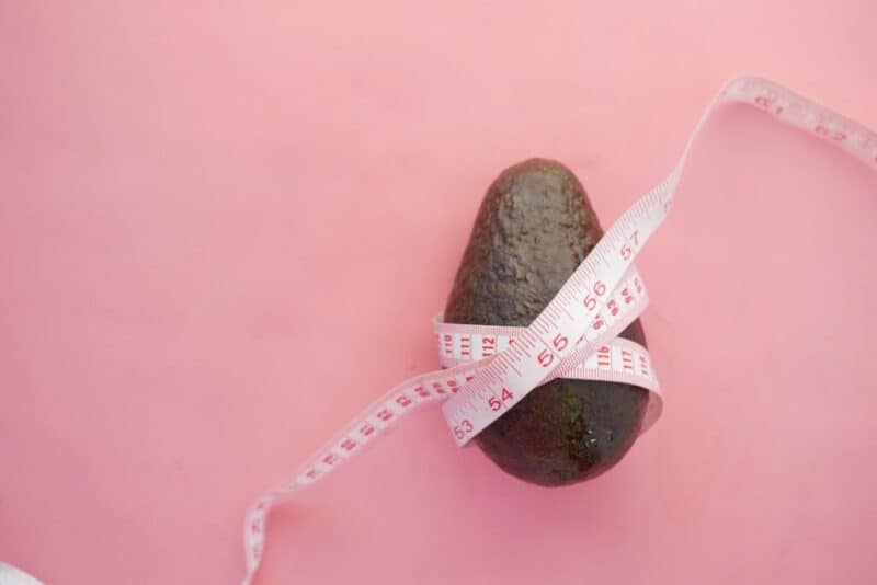 avocado with measuring tape