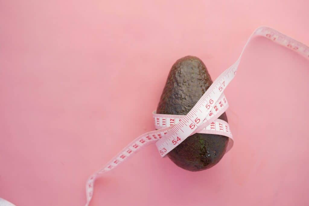 avocado with measuring tape